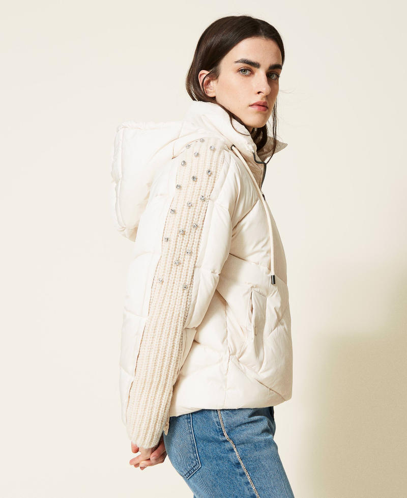 Puffer jacket with embroidered knit inserts