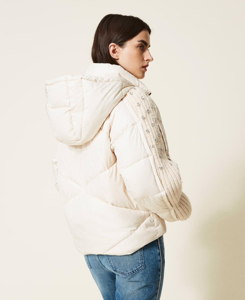 Puffer jacket with embroidered knit inserts