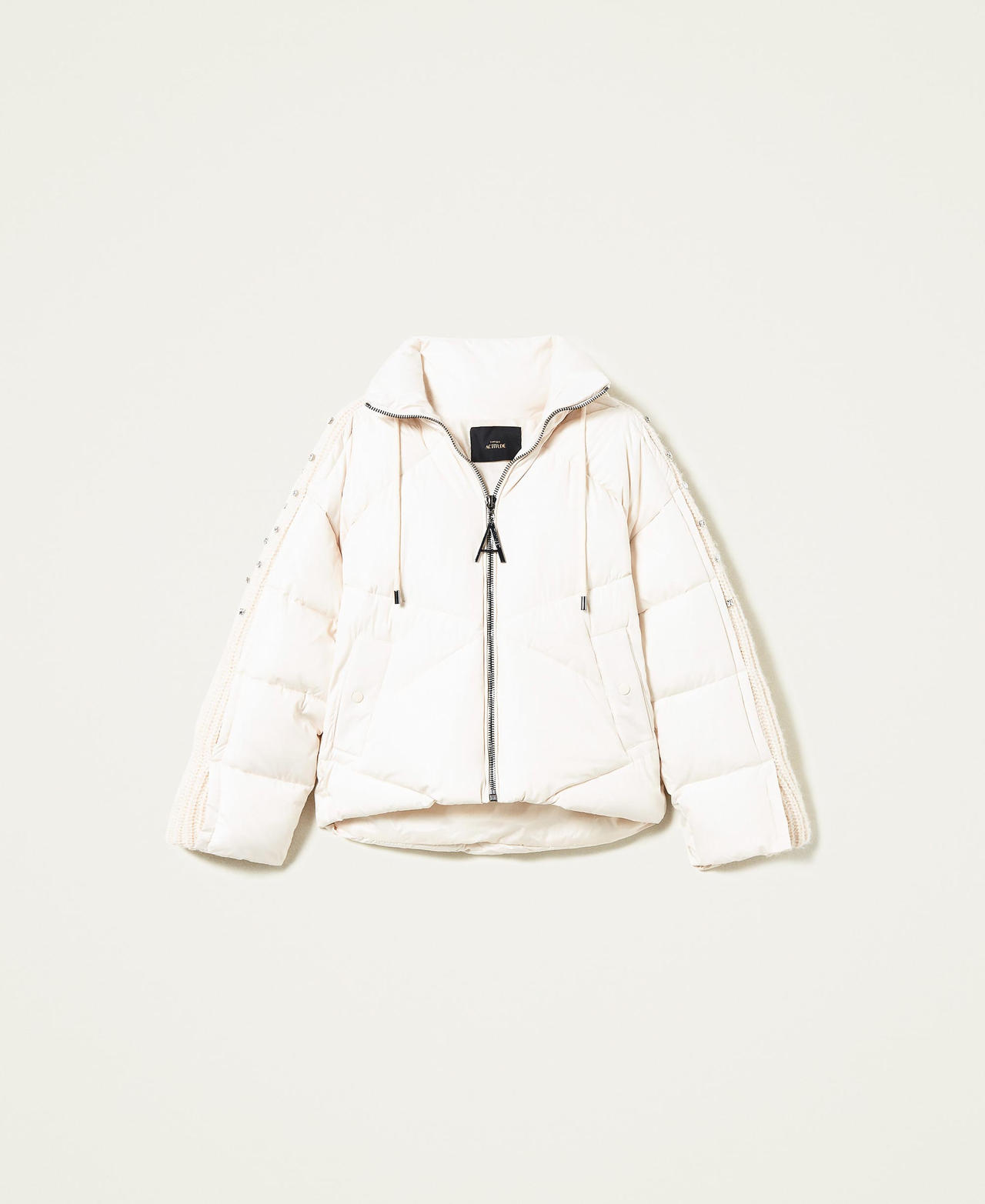 Puffer jacket with embroidered knit inserts