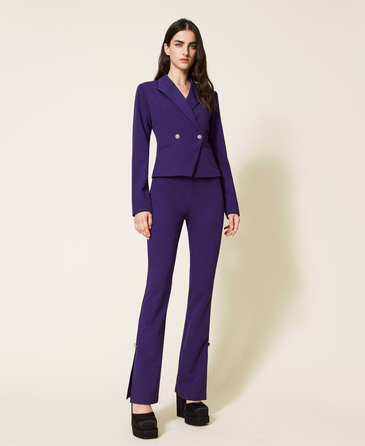 Flared flannel trousers with jewel buttons