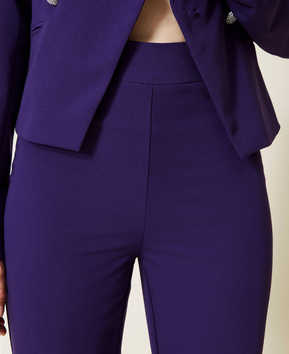Pantaloni flare in flanella con bottoni gioiello