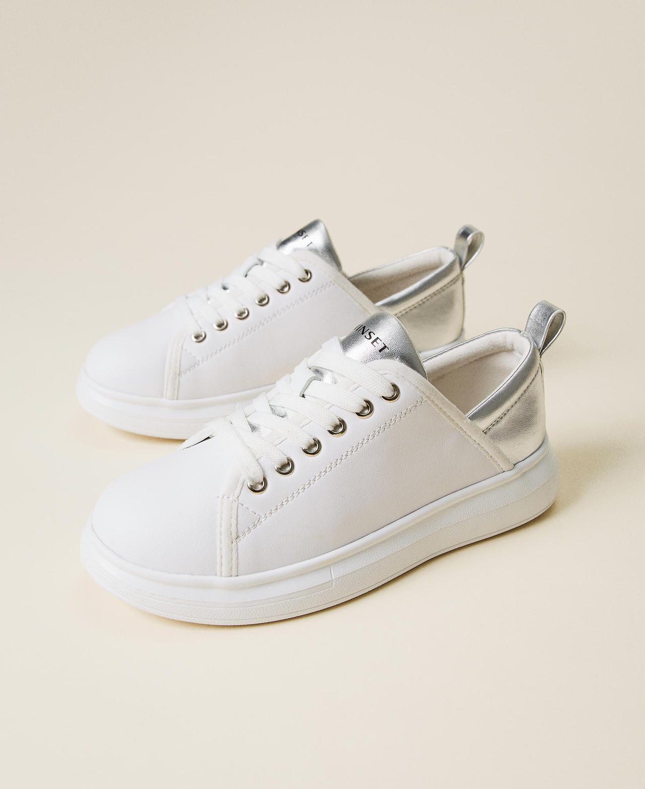 Trainers with laminated insert