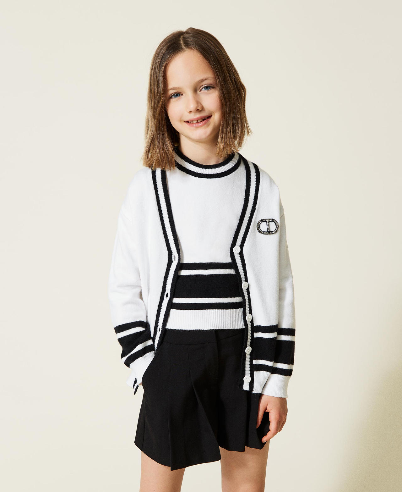 Cardigan e top con righe