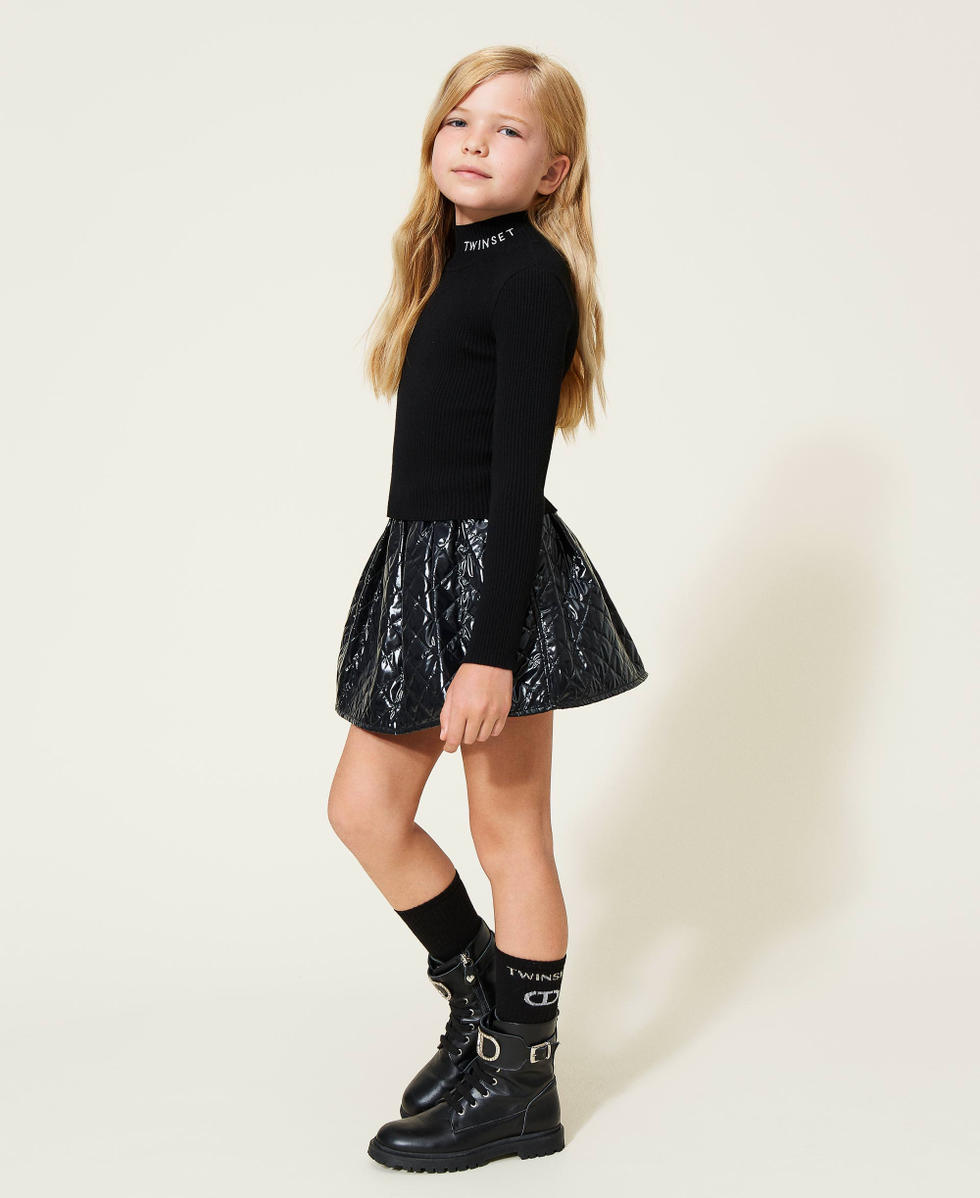 Ribbed turtleneck and diamond-patterned skirt