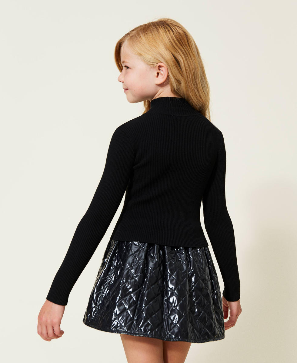 Ribbed turtleneck and diamond-patterned skirt