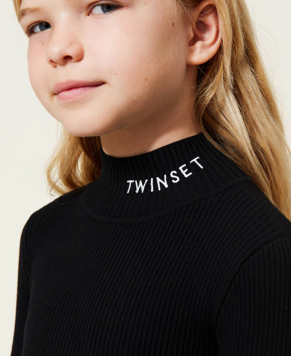 Ribbed turtleneck and diamond-patterned skirt