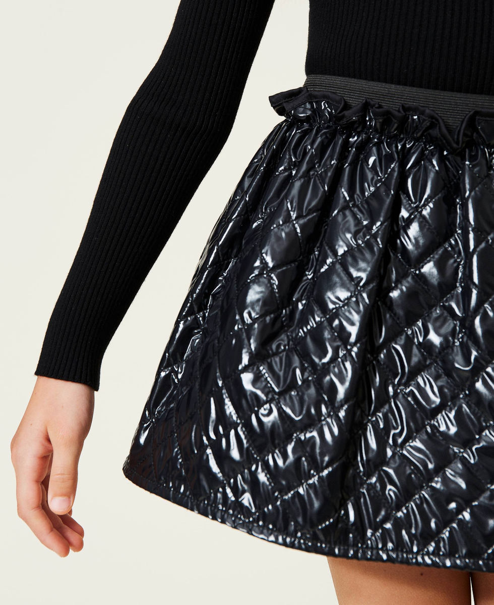 Ribbed turtleneck and diamond-patterned skirt