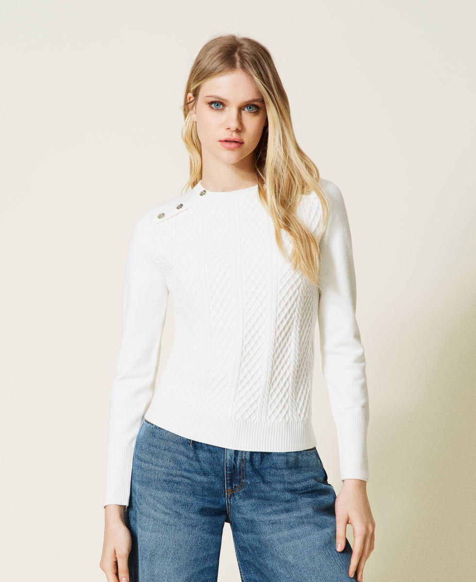 Pull &agrave; losanges avec boutons