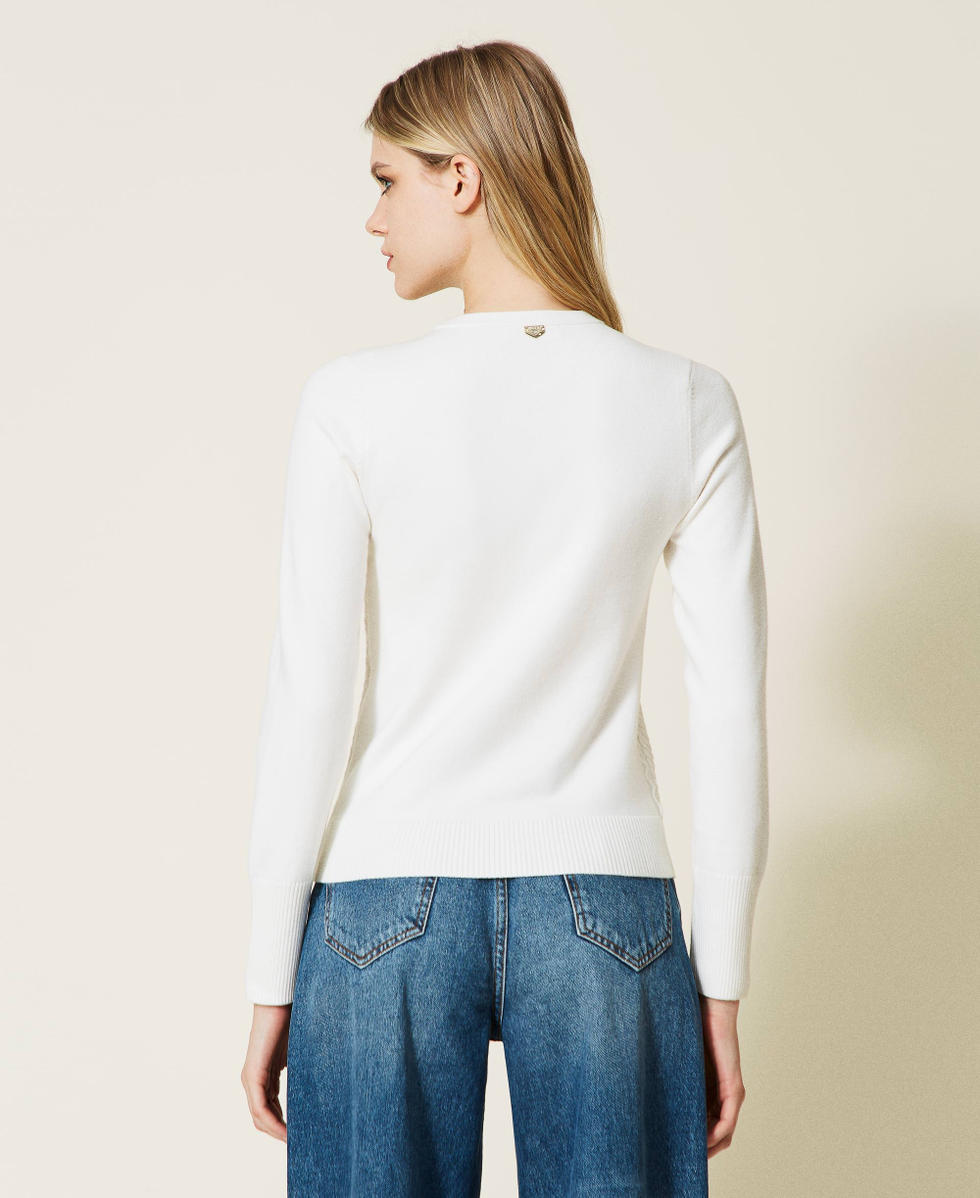 Pull &agrave; losanges avec boutons