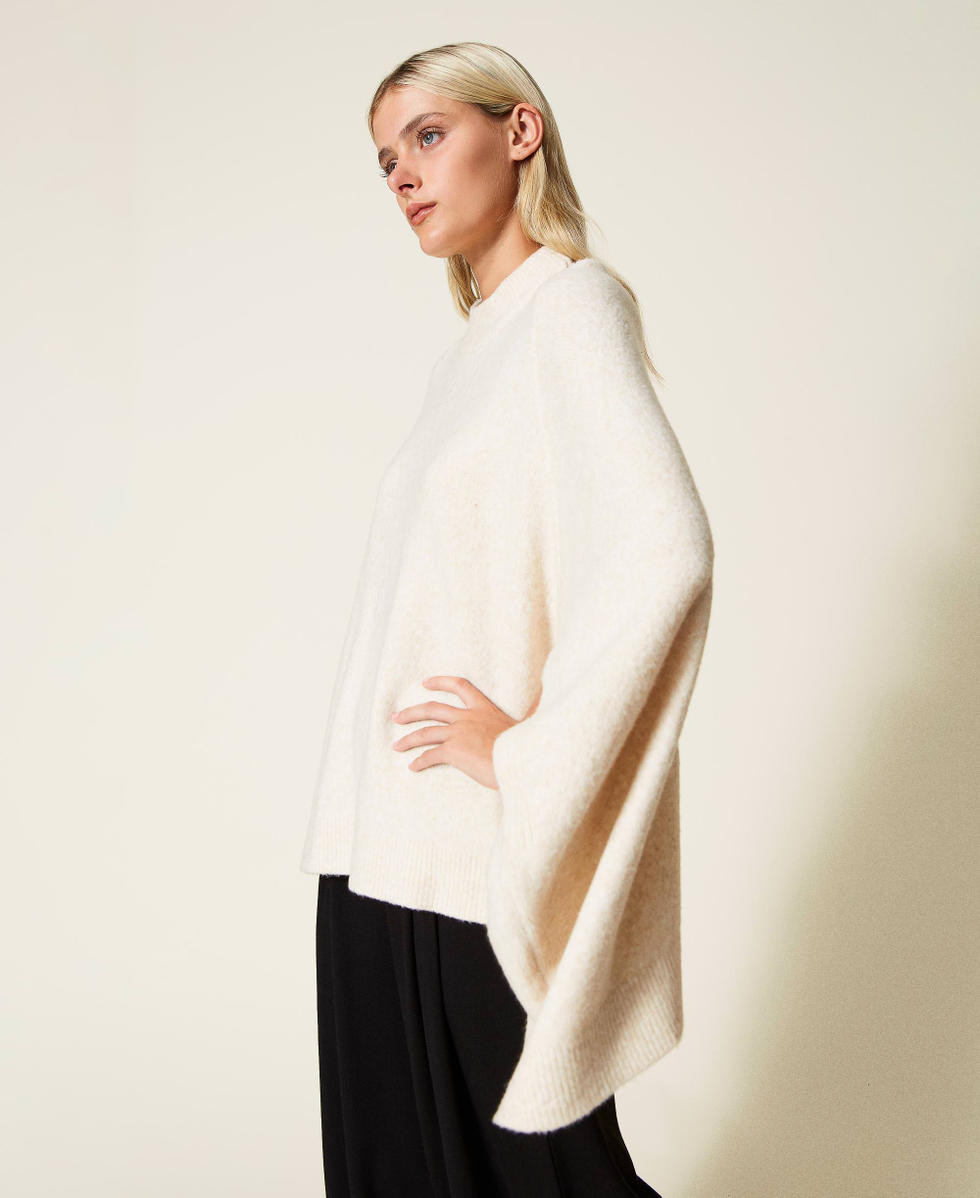 Roller neck knit cape