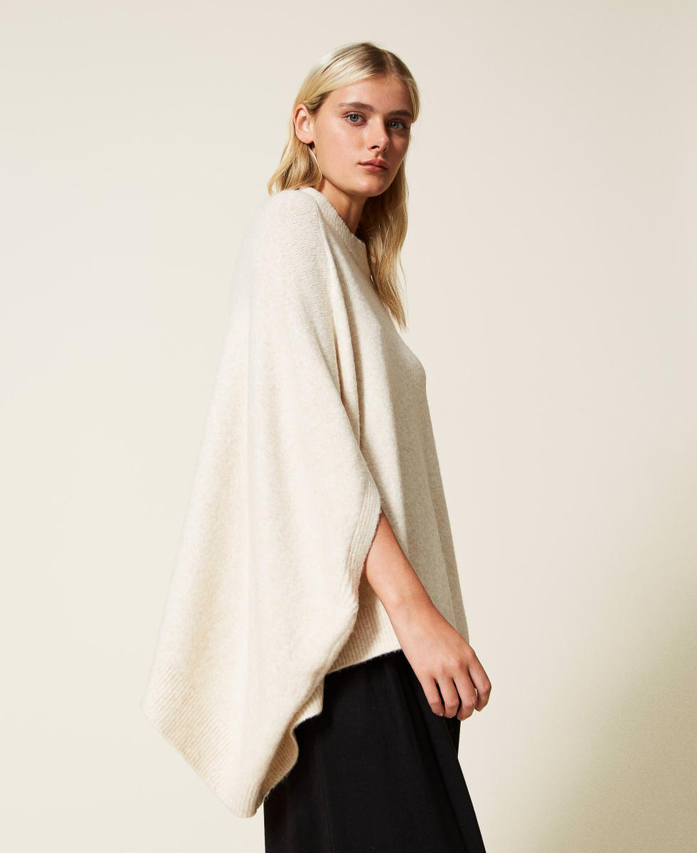 Roller neck knit cape