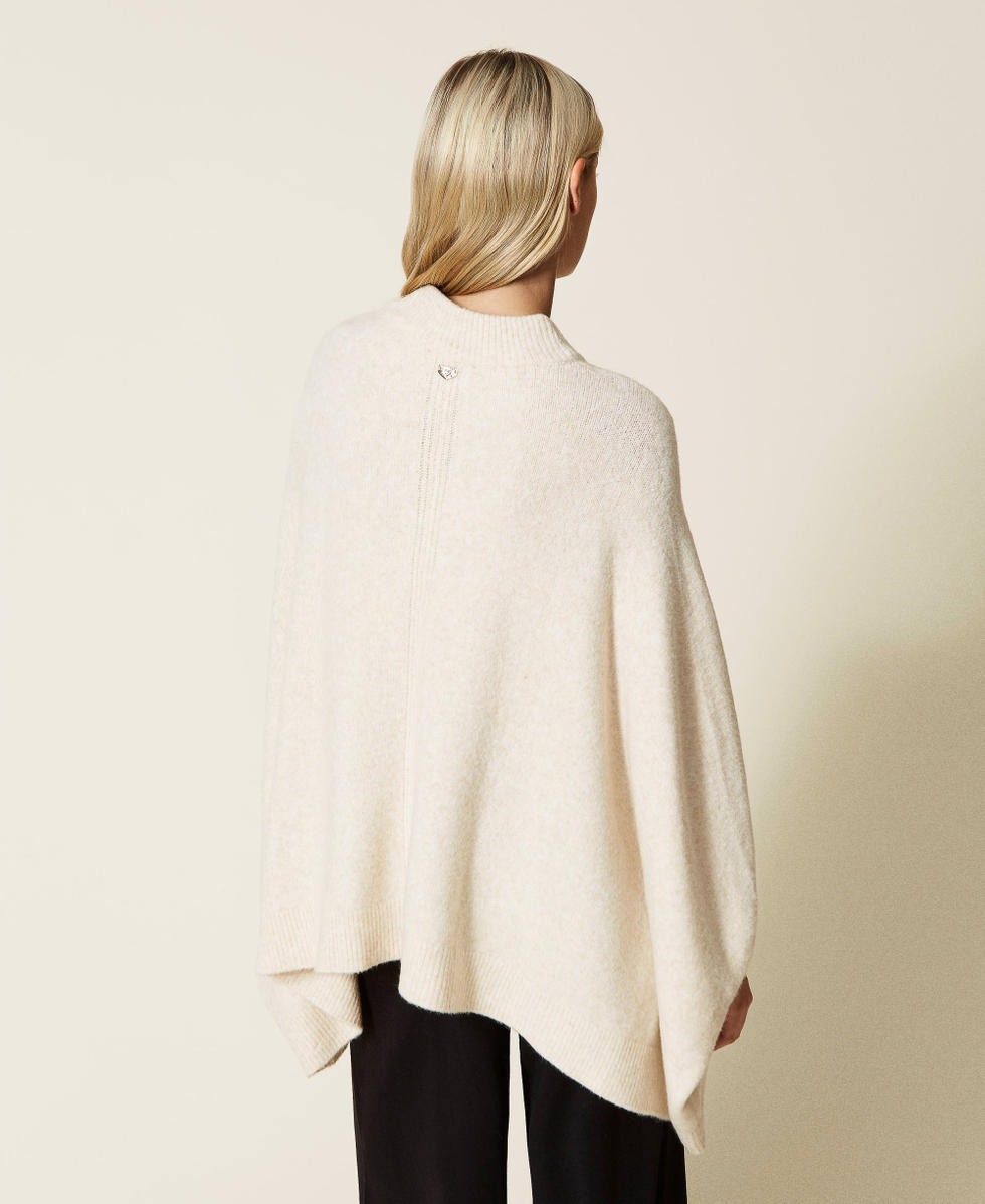 Roller neck knit cape