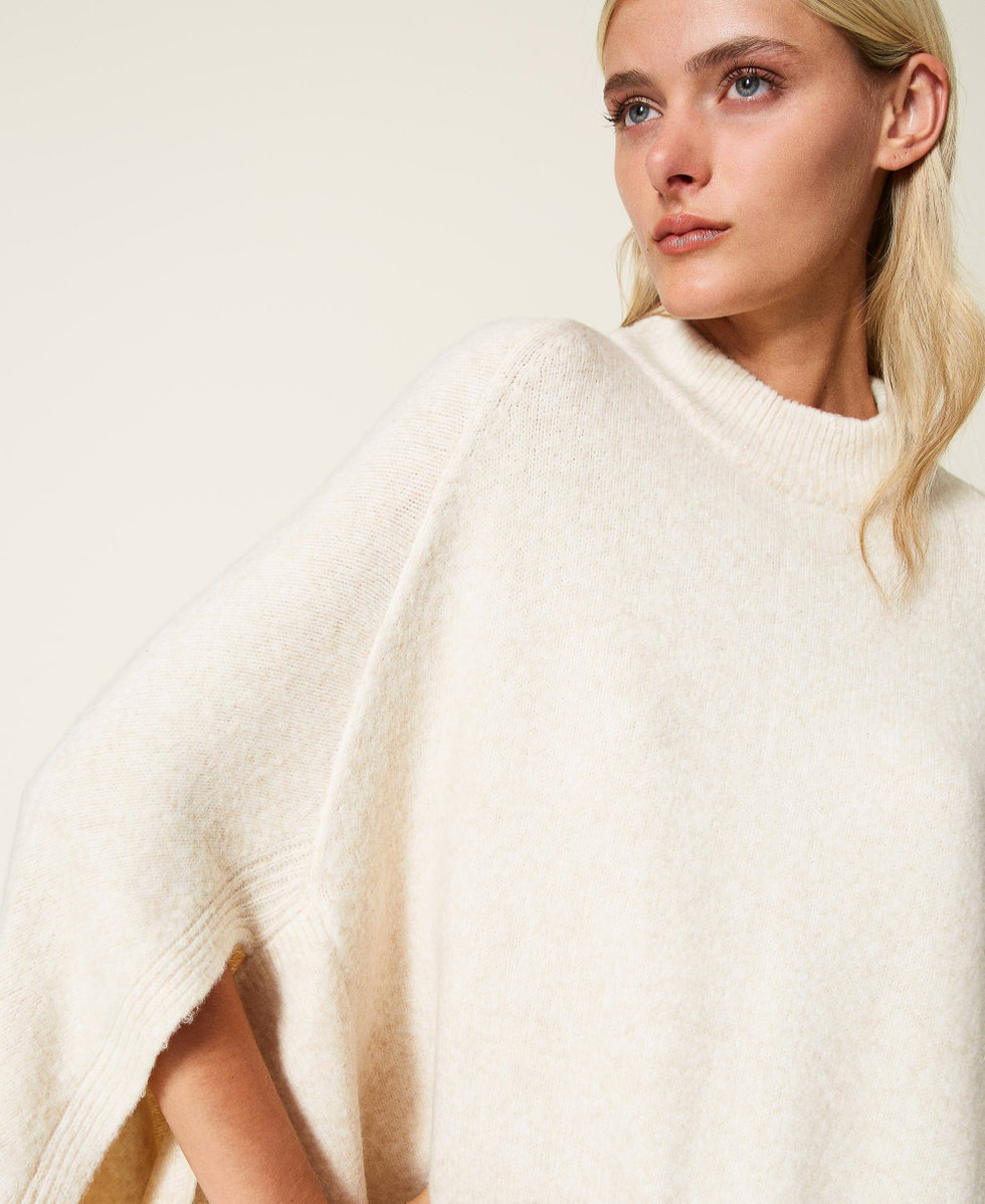 Roller neck knit cape