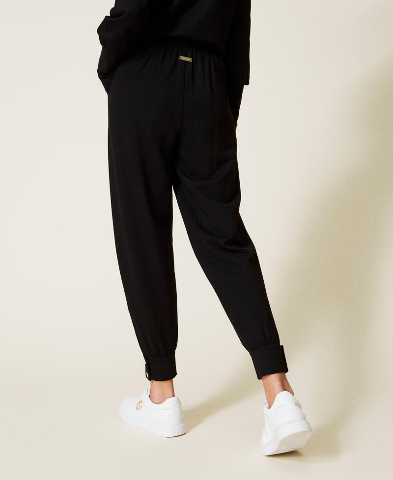 Plush fabric joggers with buttons