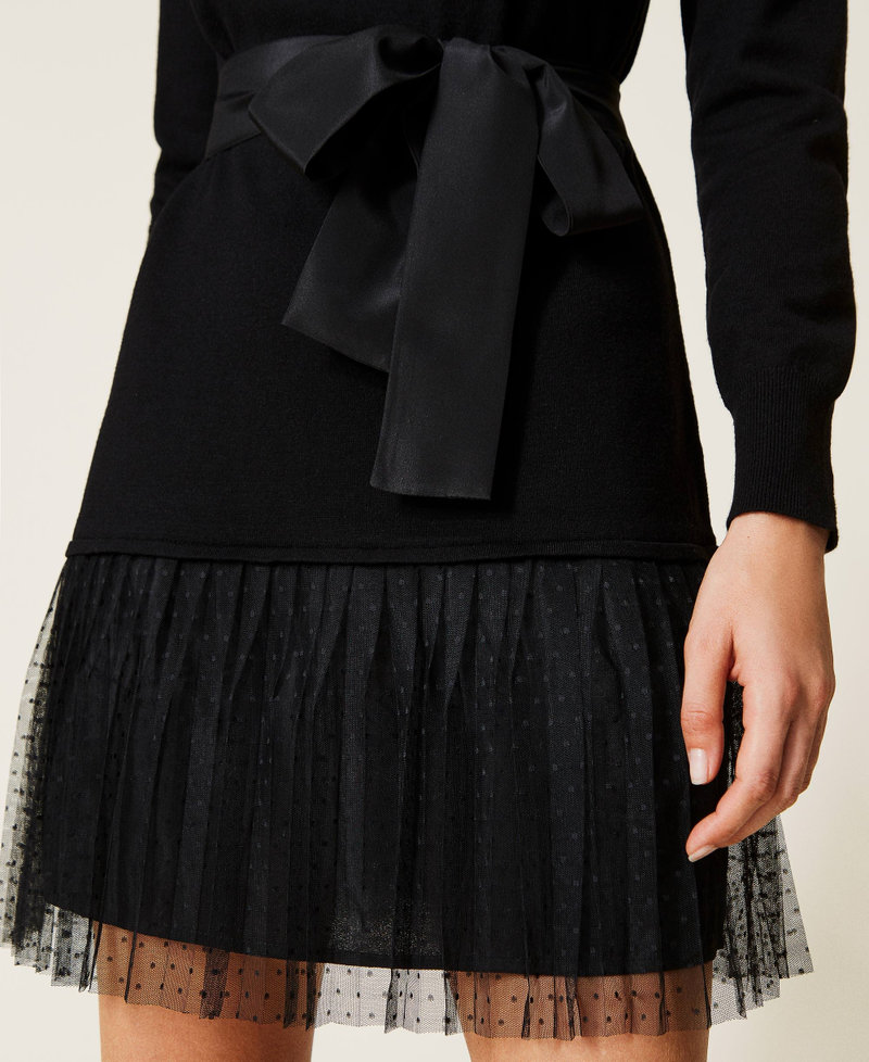 Knit dress with tulle flounce and belt