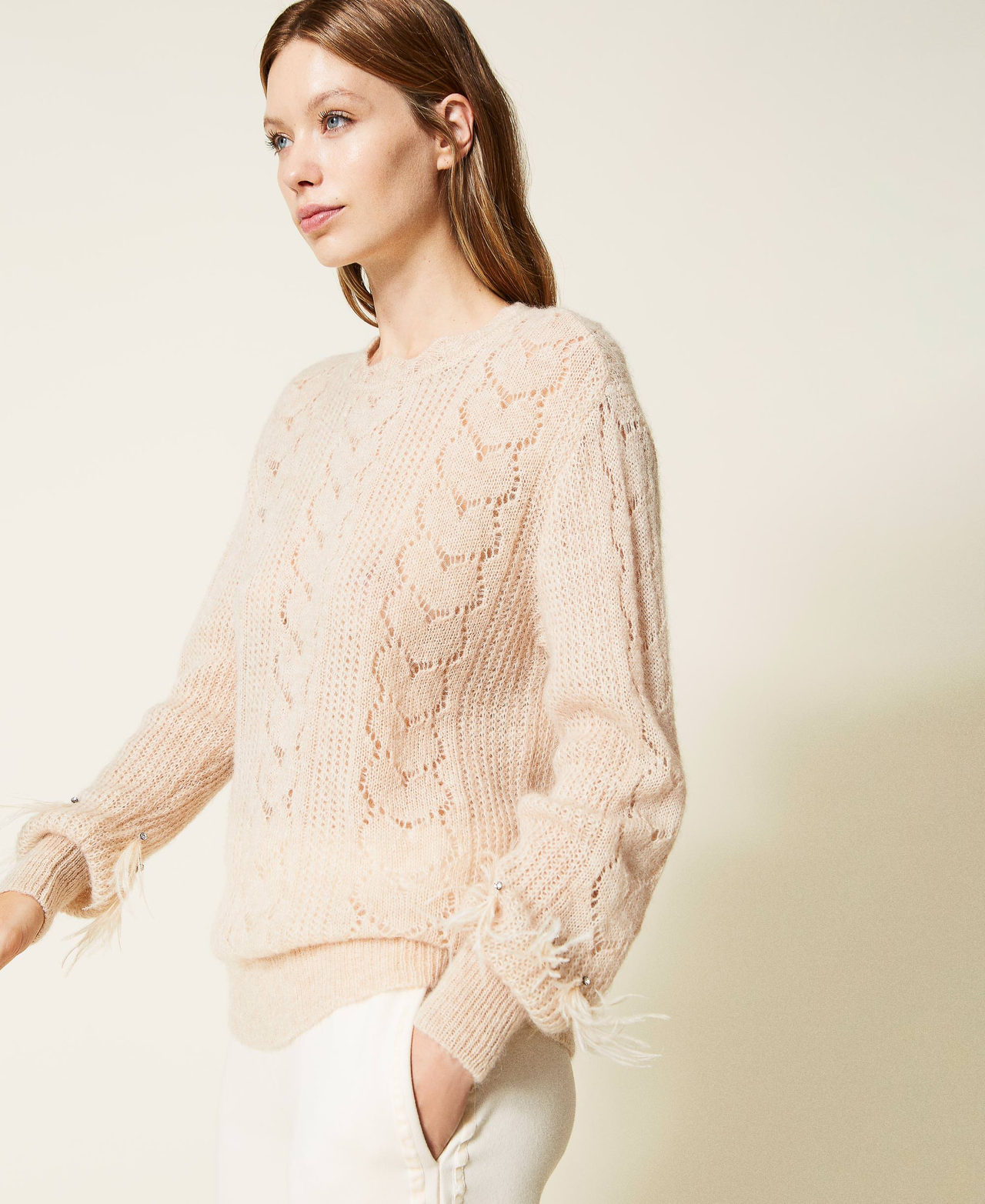 Jumper with feathers and rhinestones