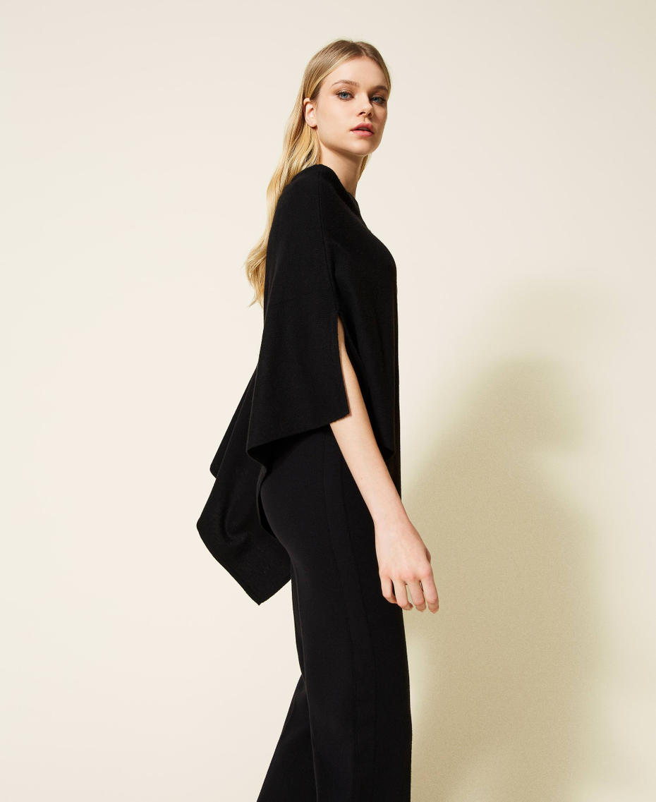 Wool blend poncho with handmade embroidery