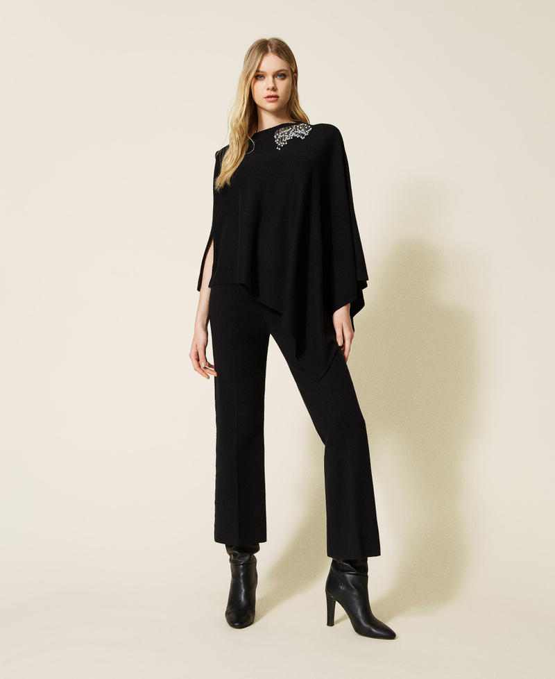 Wool blend poncho with handmade embroidery