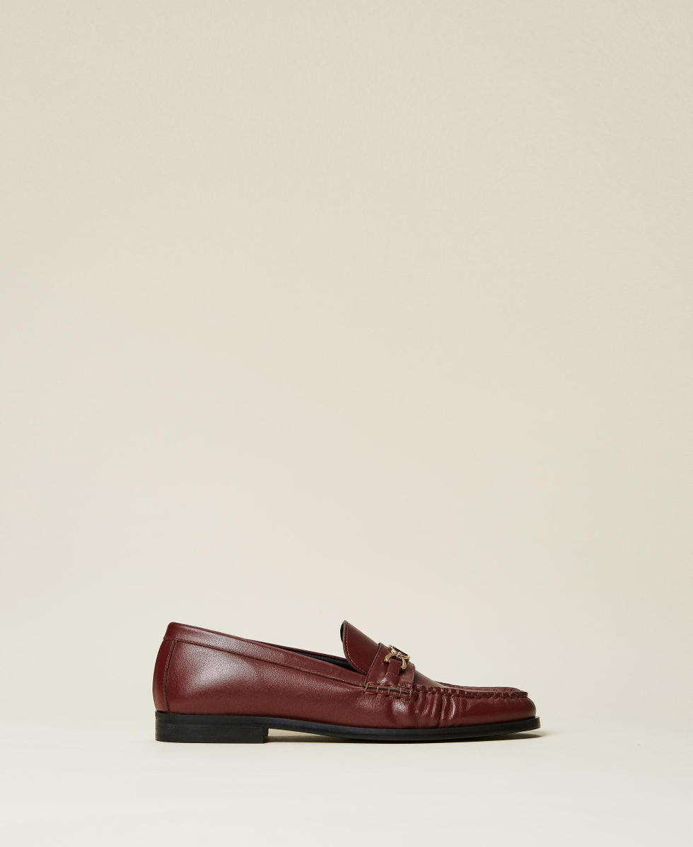 Leather loafers with logo clasp