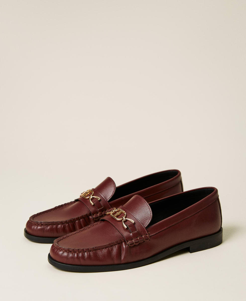 Leather loafers with logo clasp