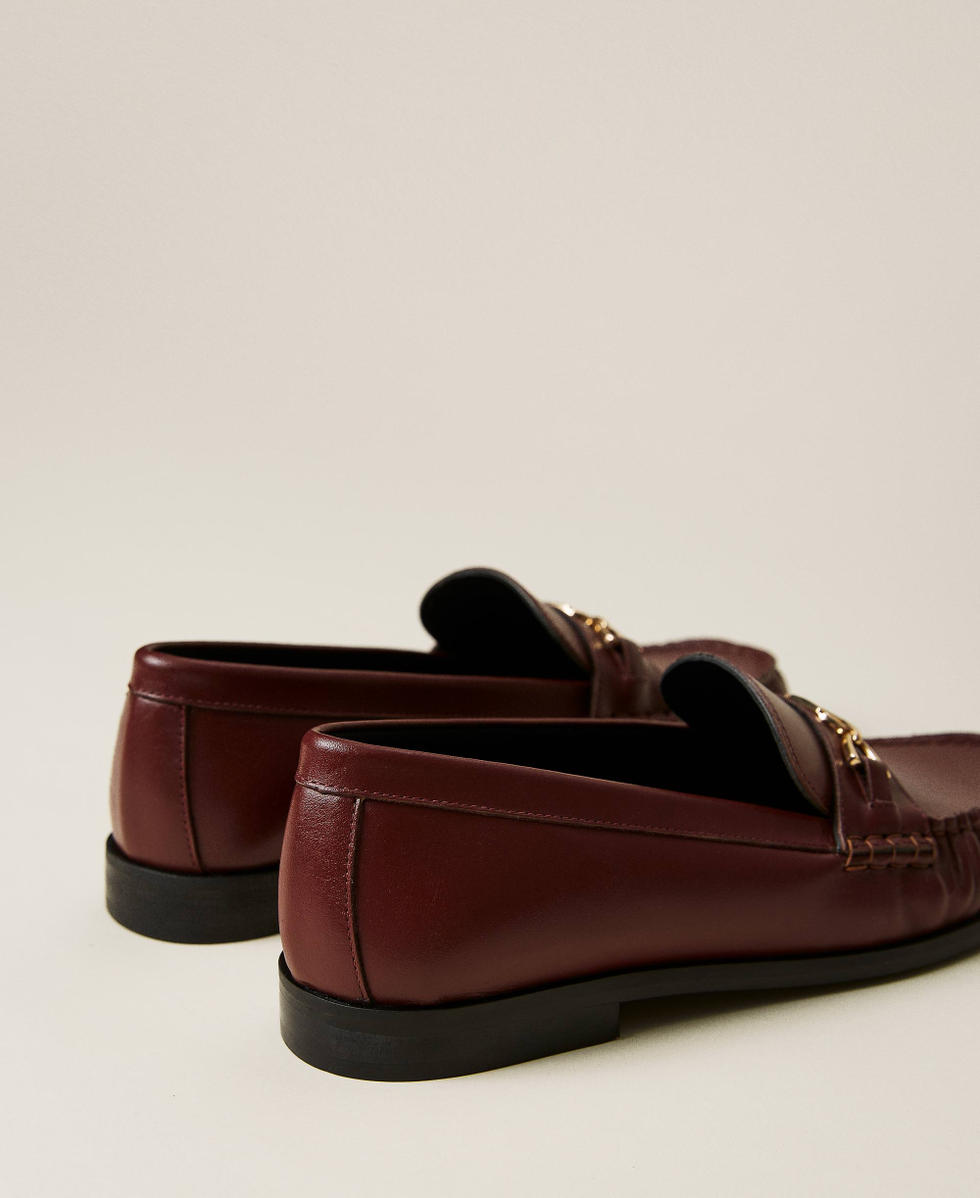 Leather loafers with logo clasp