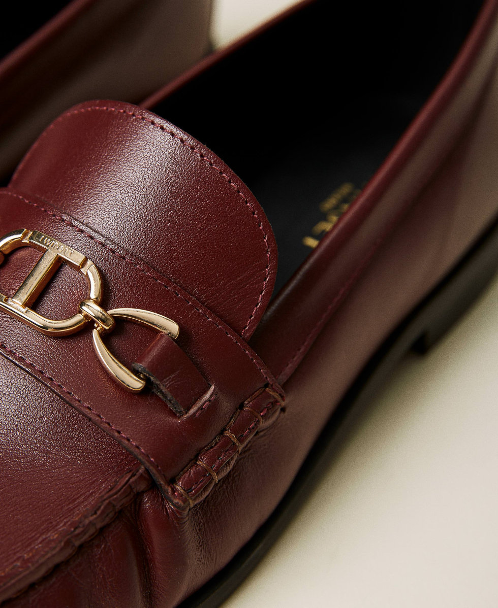 Leather loafers with logo clasp