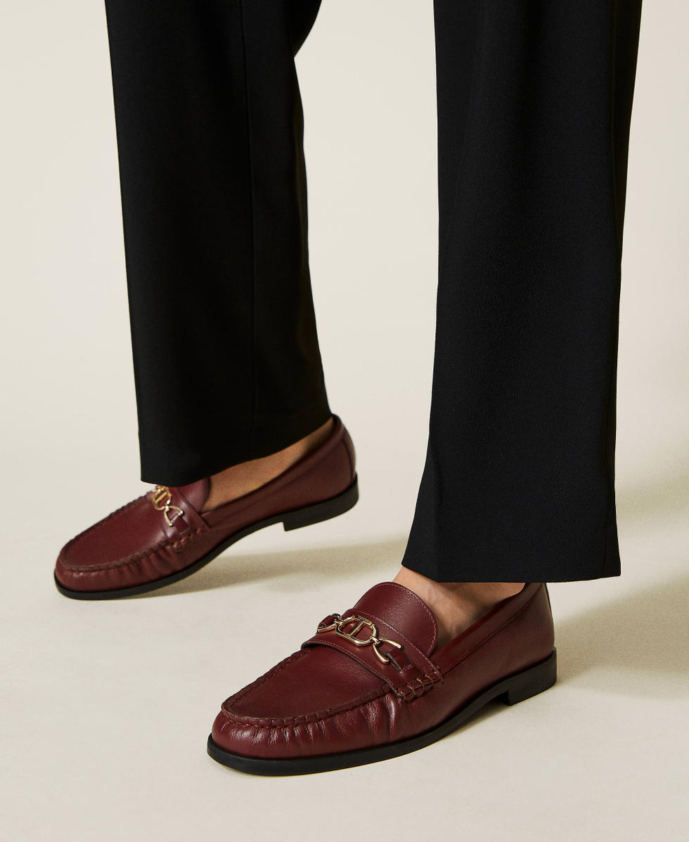Leather loafers with logo clasp