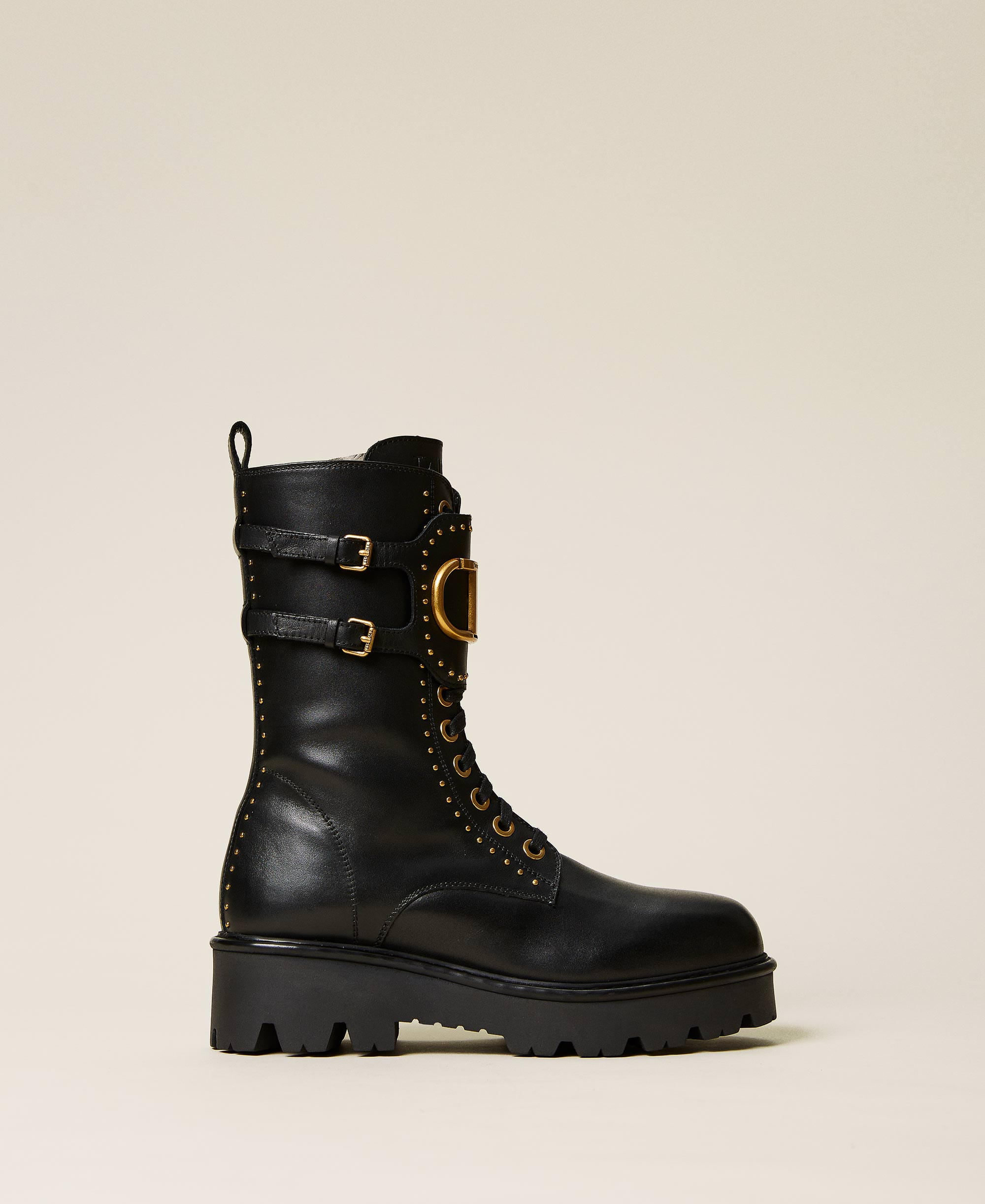 Leather combat boots with rivets and logo