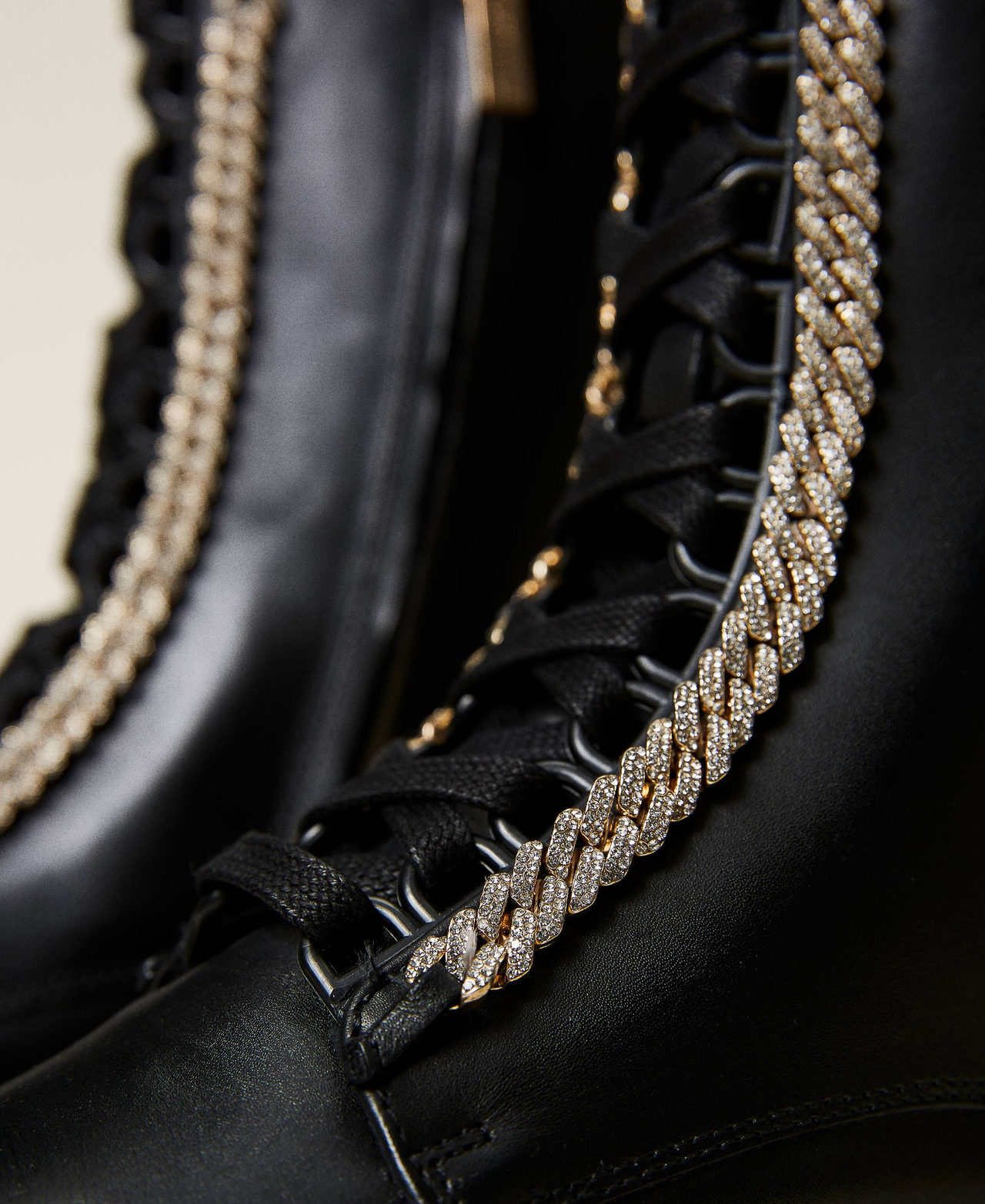 Leather combat boots with rhinestone chain