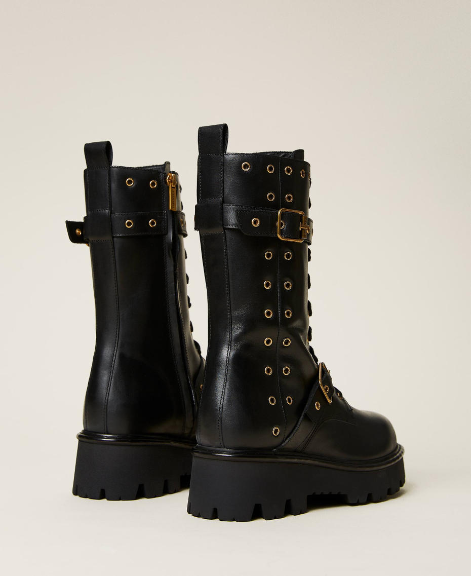 Bottines motardes en cuir avec œillets décoratifs
