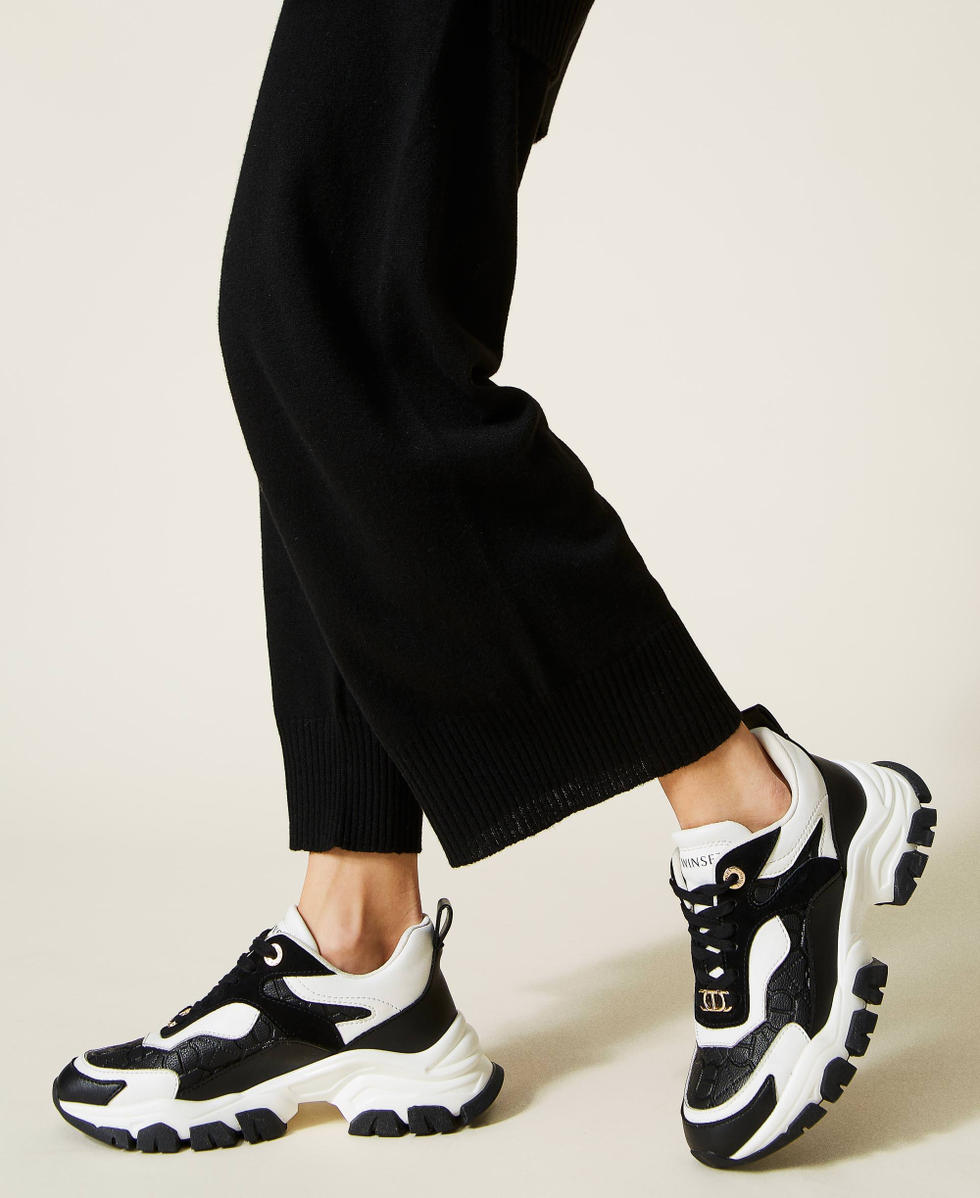 Running shoes with Oval T logo