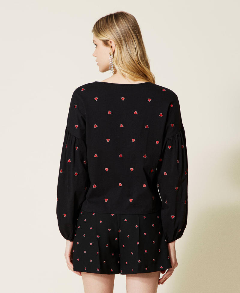 Cr&ecirc;pe blouse with embroidered hearts