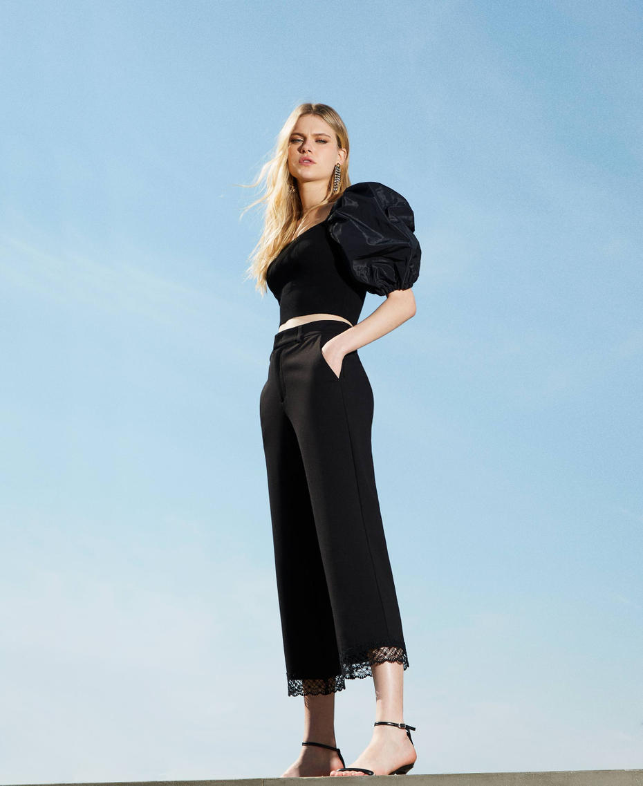 Cropped trousers with macram&eacute; lace