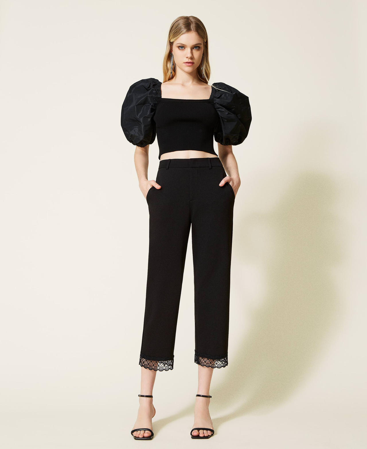 Cropped trousers with macram&eacute; lace