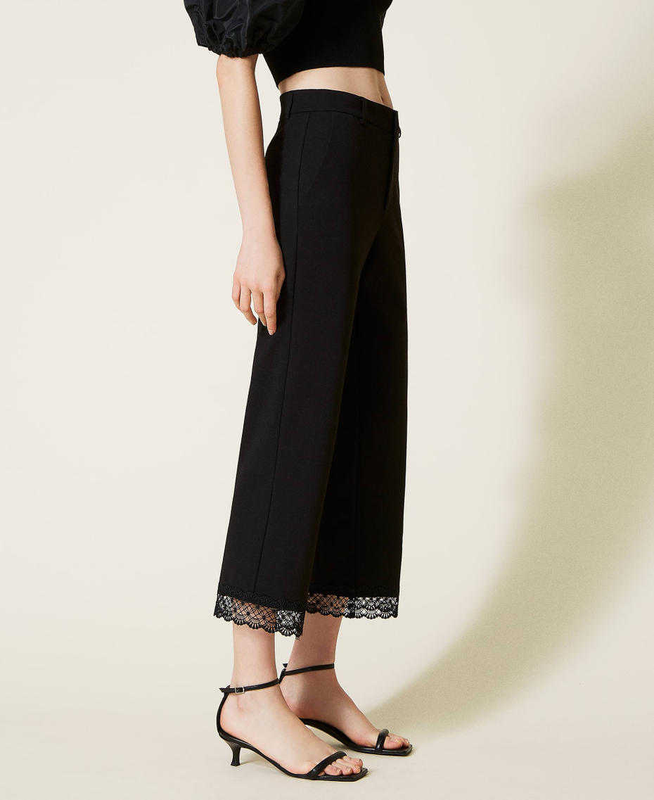 Cropped trousers with macram&eacute; lace