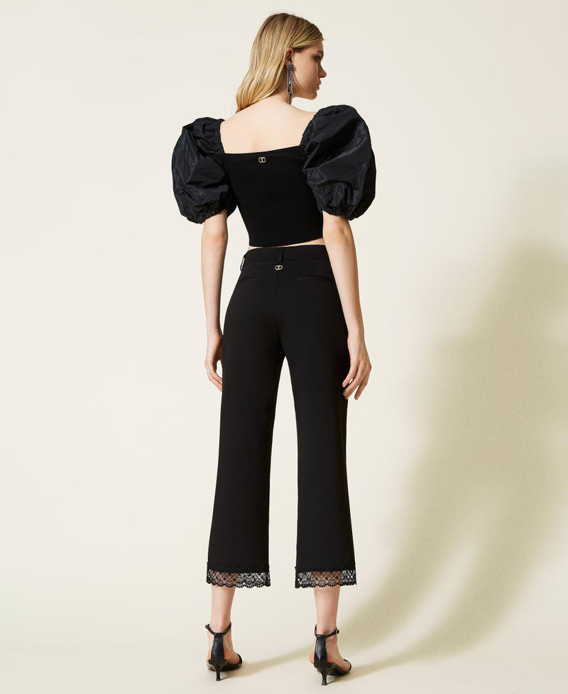 Cropped trousers with macram&eacute; lace