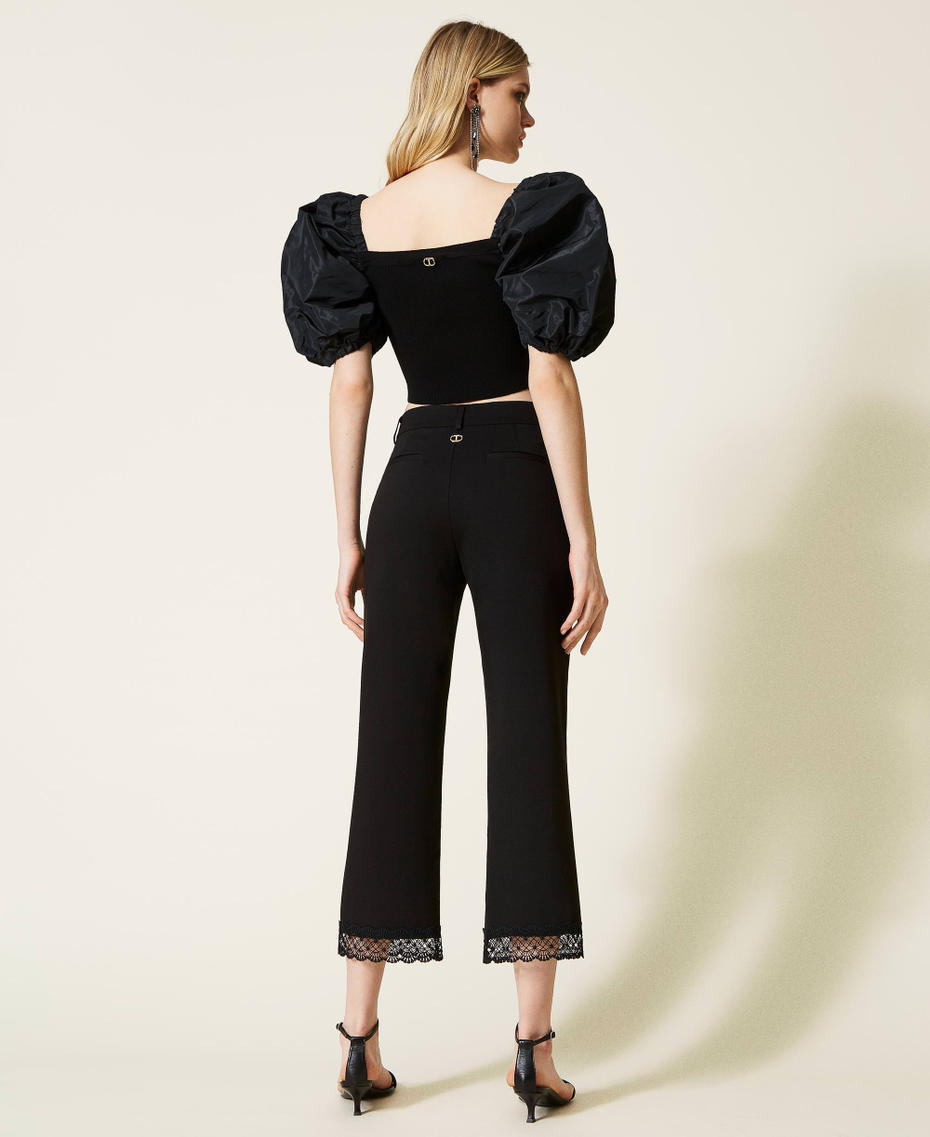 Cropped trousers with macram&eacute; lace