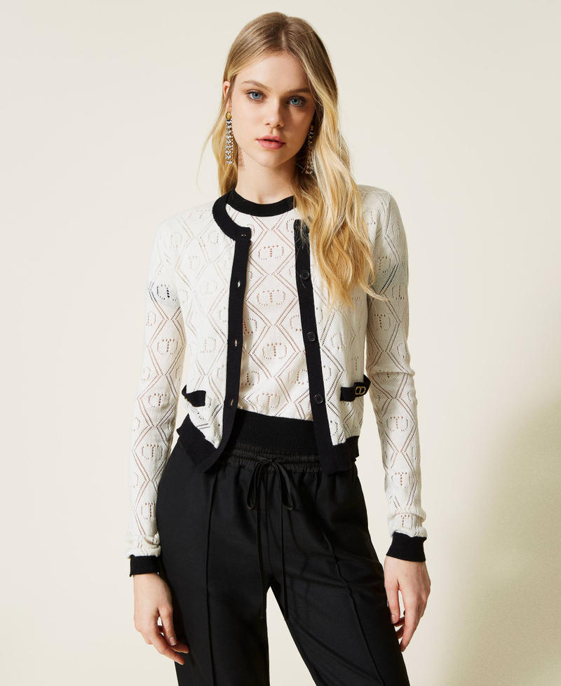 Cardigan and jumper with openwork logo