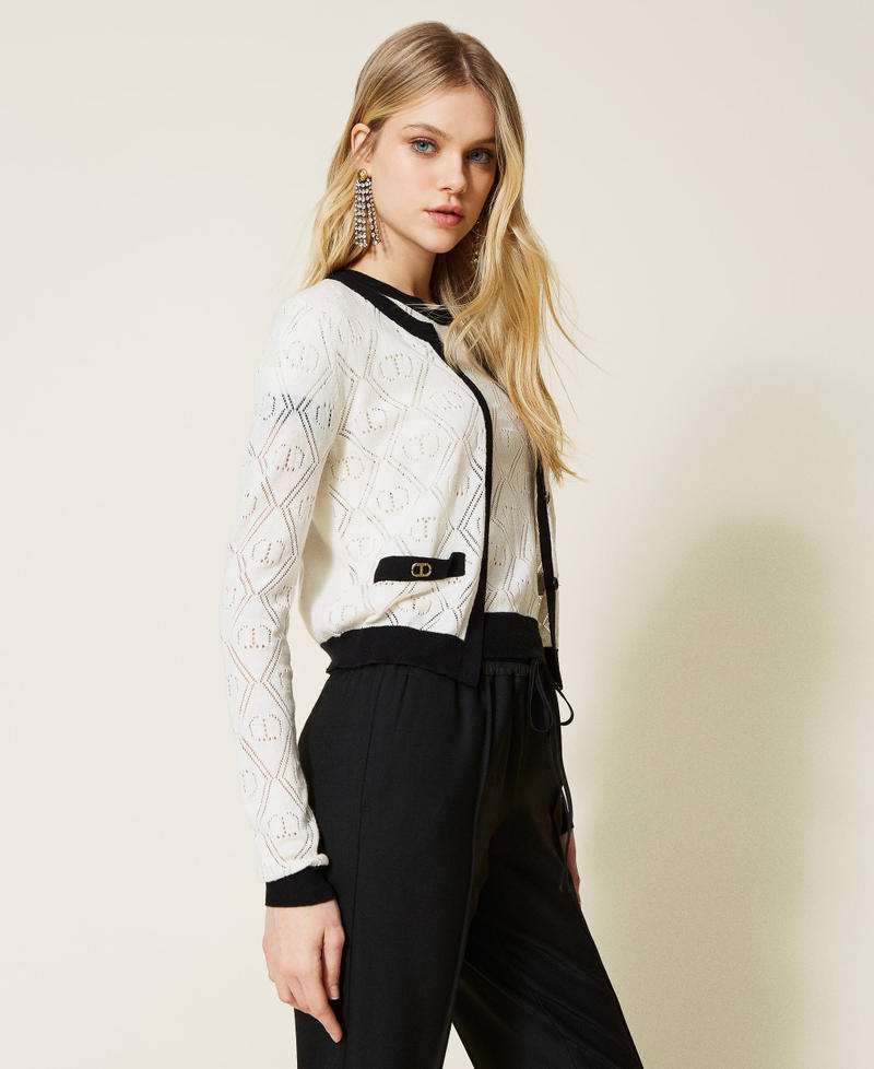 Cardigan and jumper with openwork logo