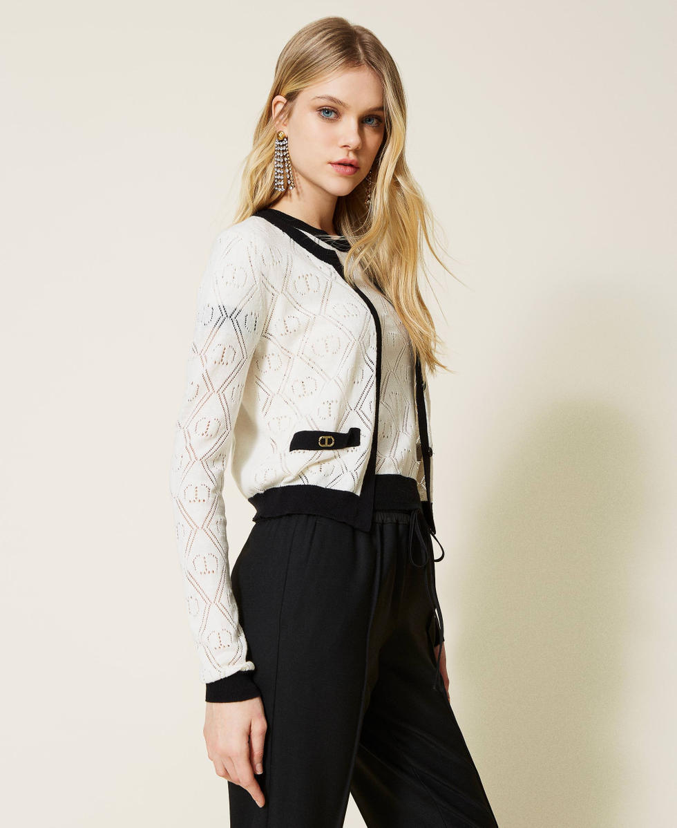 Cardigan and jumper with openwork logo