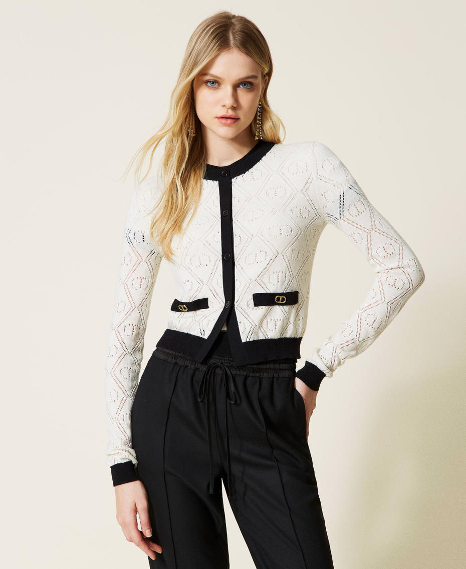 Cardigan and jumper with openwork logo