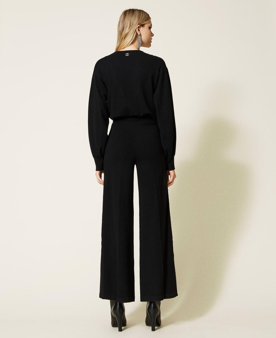 Pantalones palazzo de punto con encaje