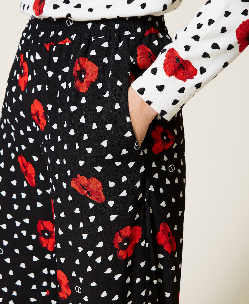 Pantaloni con stampa cuori e papaveri