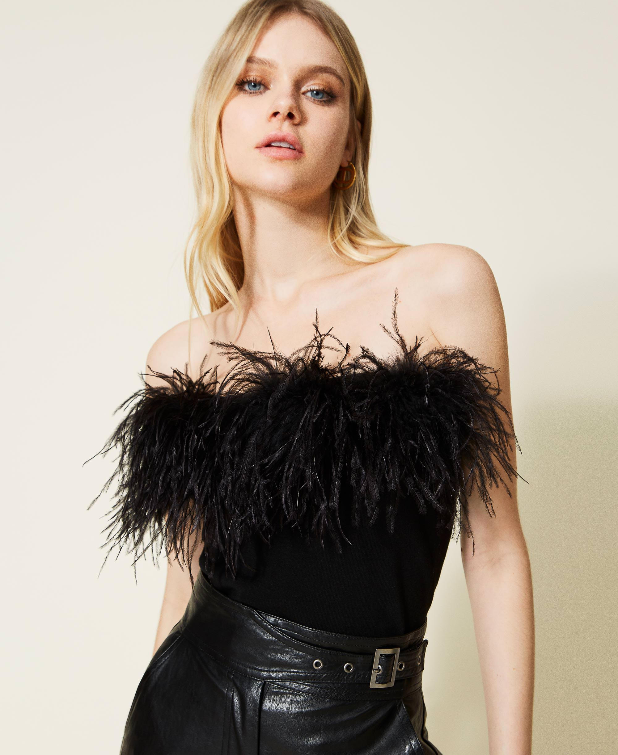 Knit top with feathers