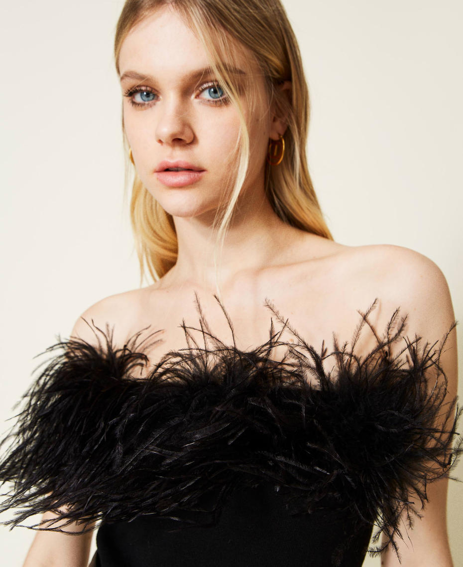 Top in maglia con piume
