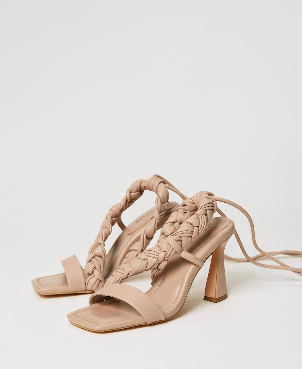Sandals with plaited band
