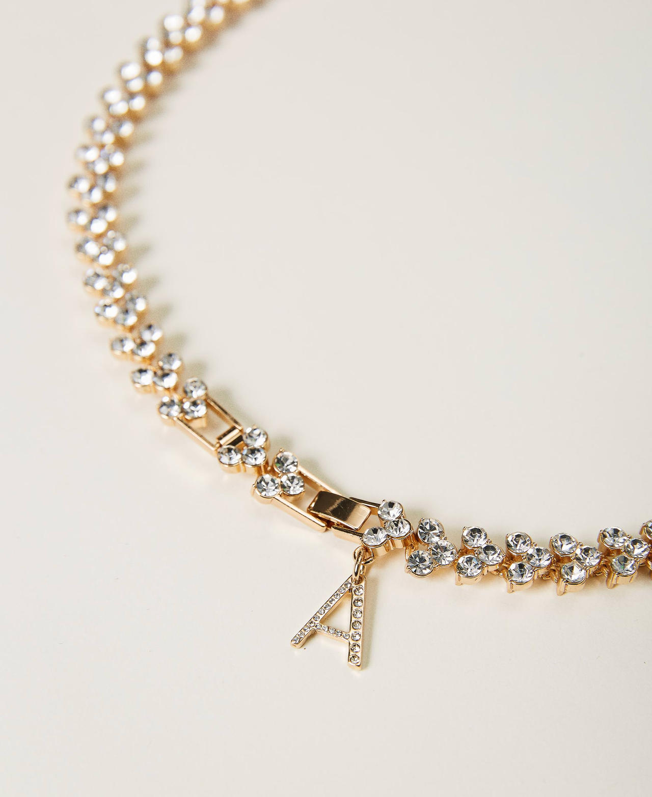 Rhinestone and logo necklace