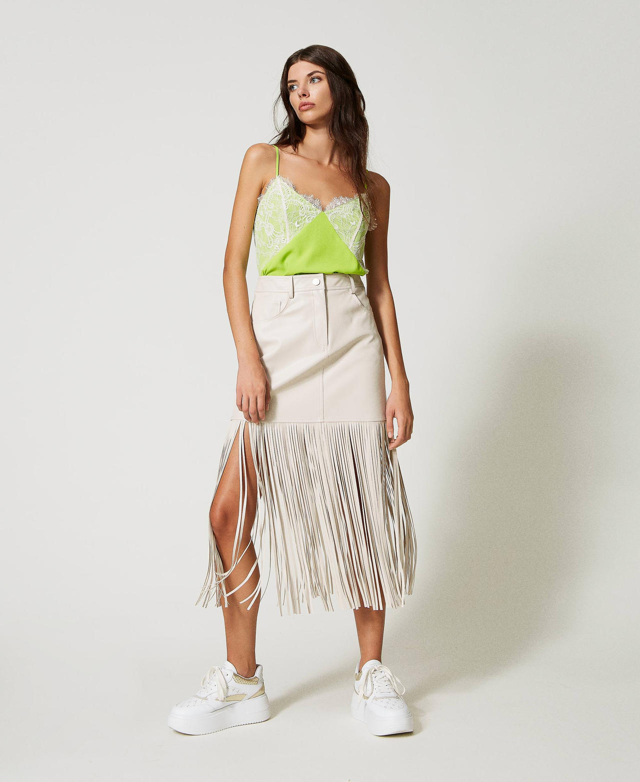 Leather-like miniskirt with fringes