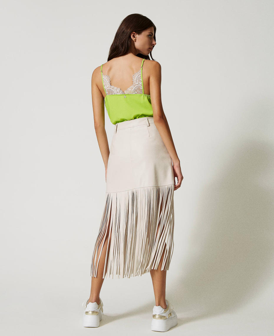 Leather-like miniskirt with fringes