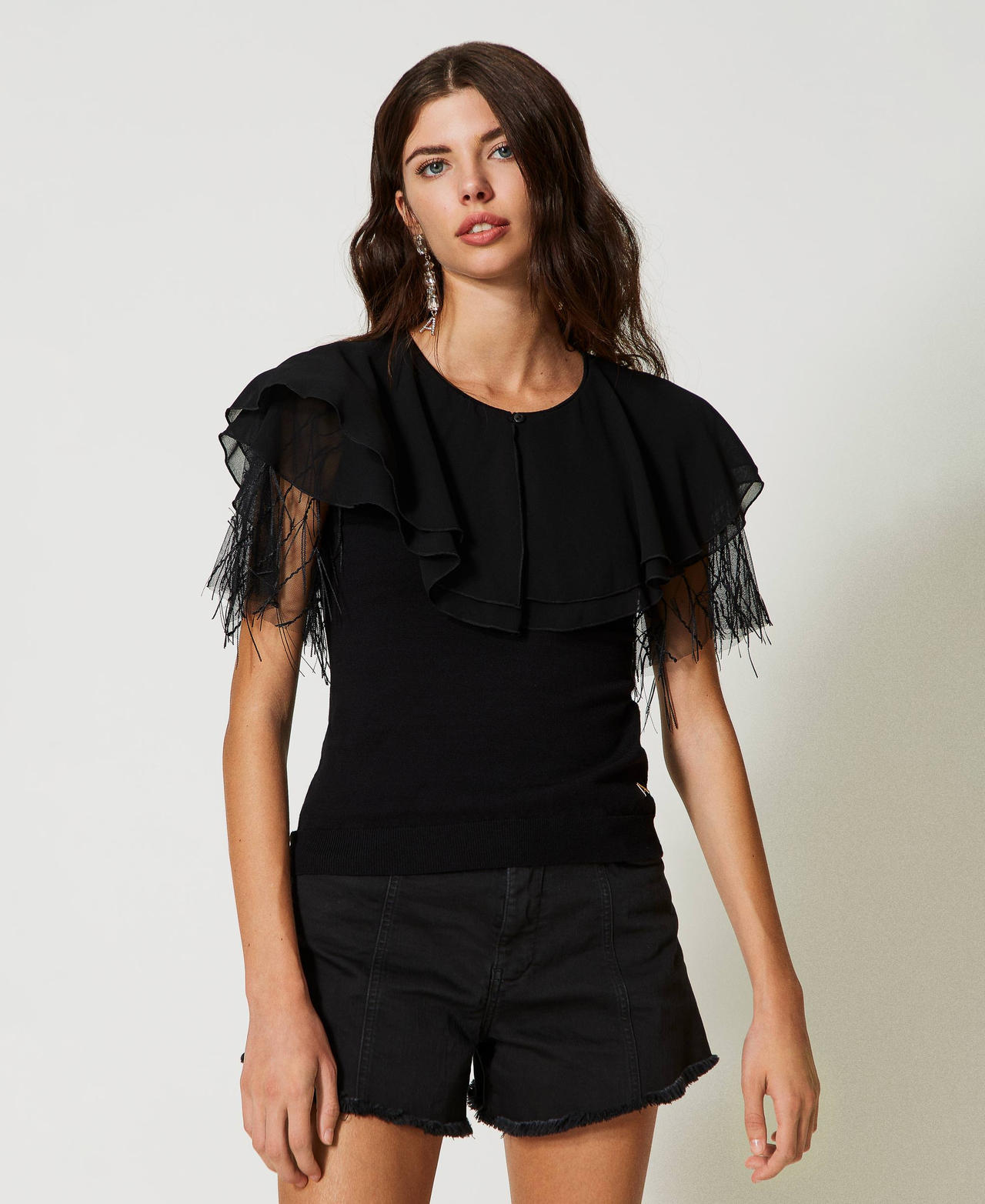 Knitted top with tulle and cape